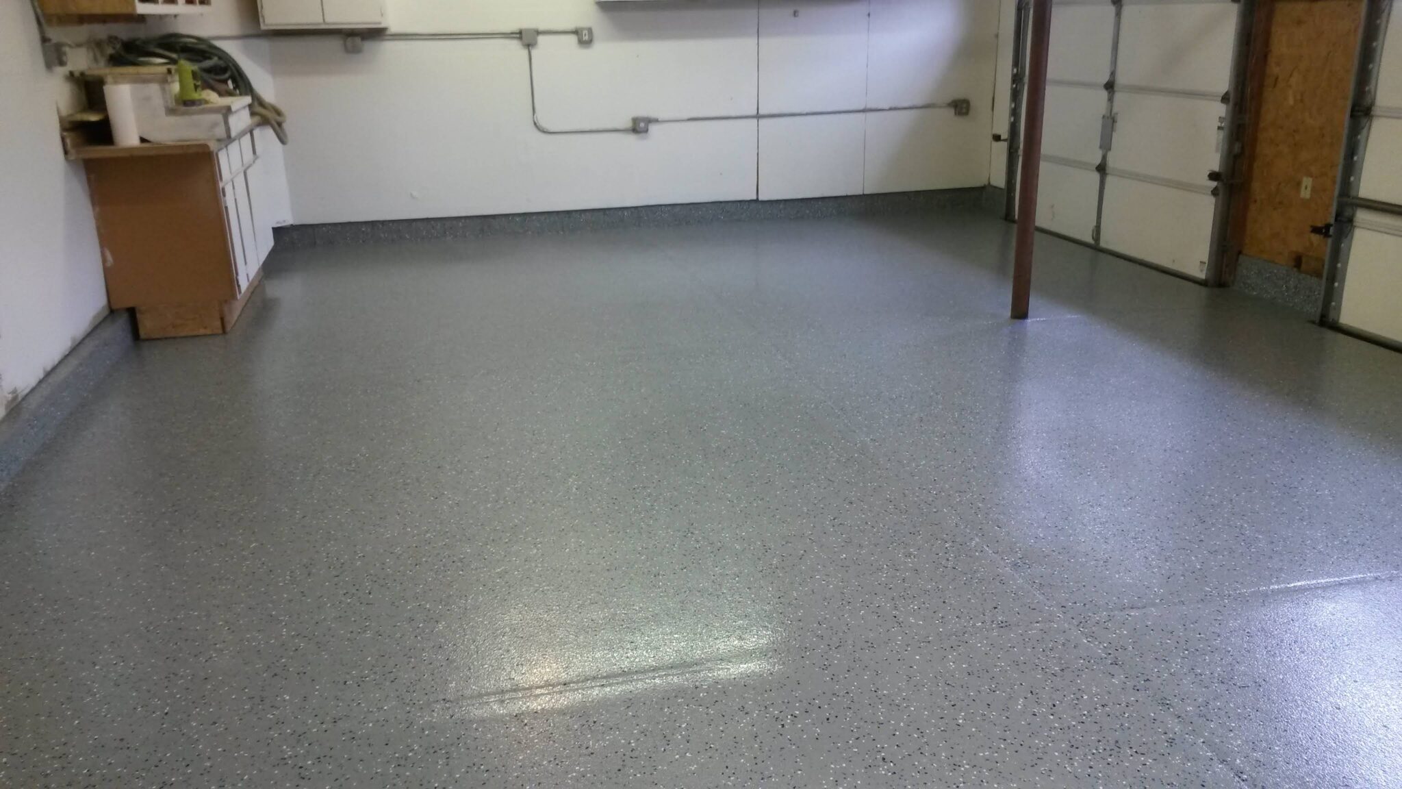 Epoxy vs. Polyaspartic Floor Coatings: Which Is Right for Your Garage or Facility?